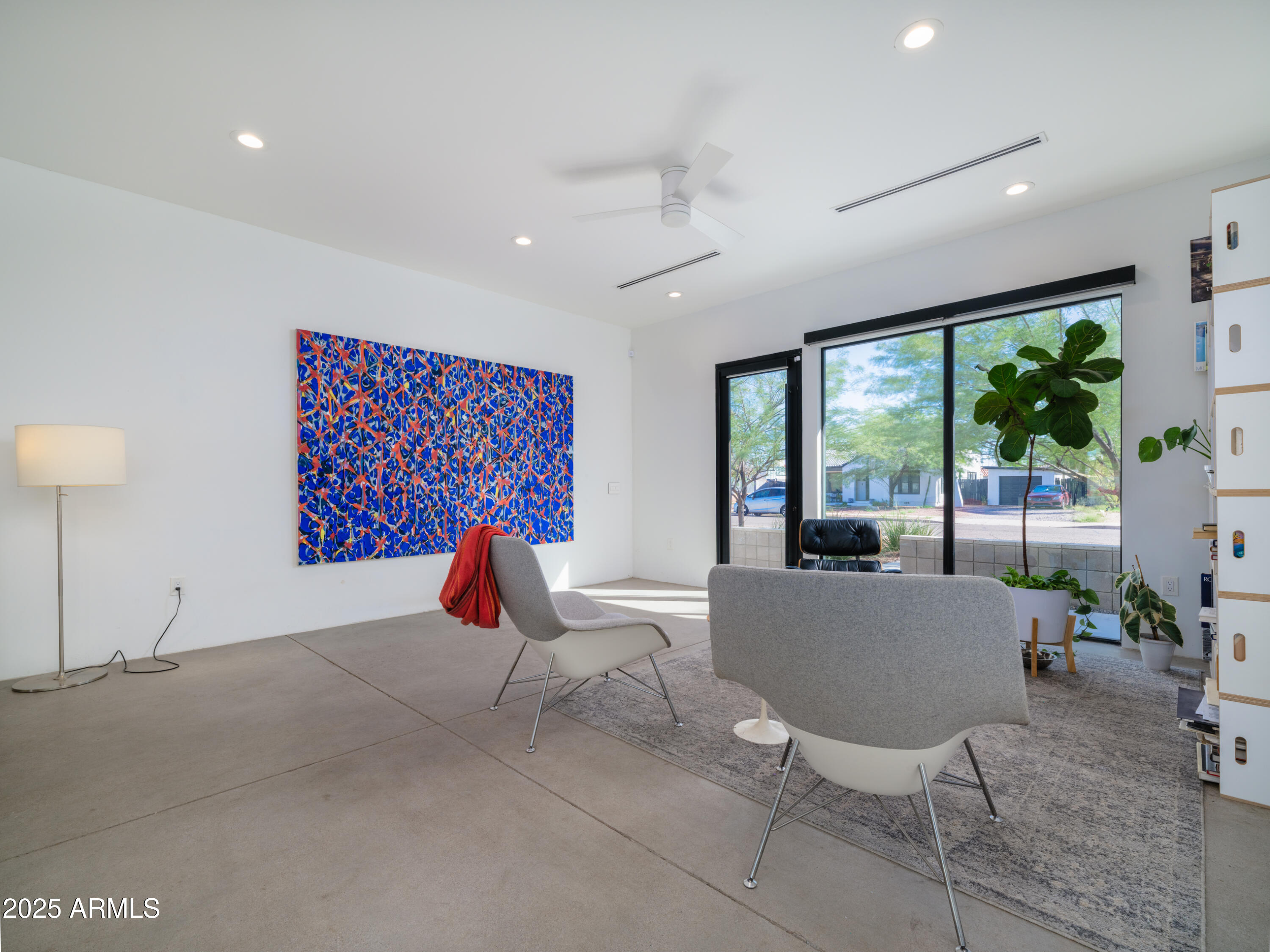 1526 East Coronado Road Phoenix, AZ 85006 - Photo 6 of 39 a living room with furniture a large window and potted plants