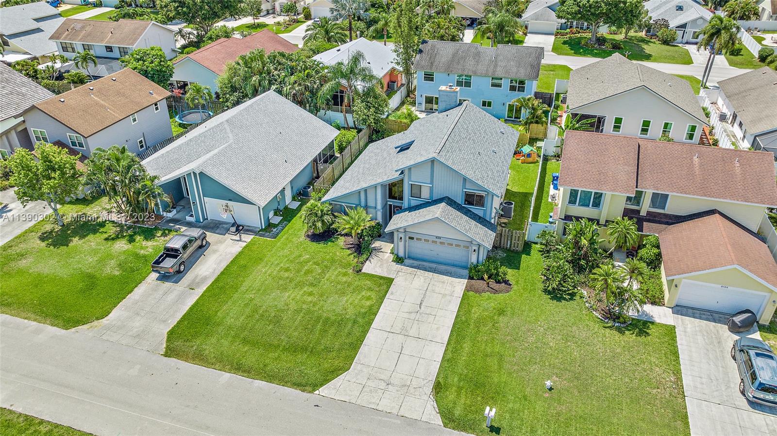 6122 Adams Street Jupiter, FL 33458 - Photo 33 of 59 an aerial view of a house