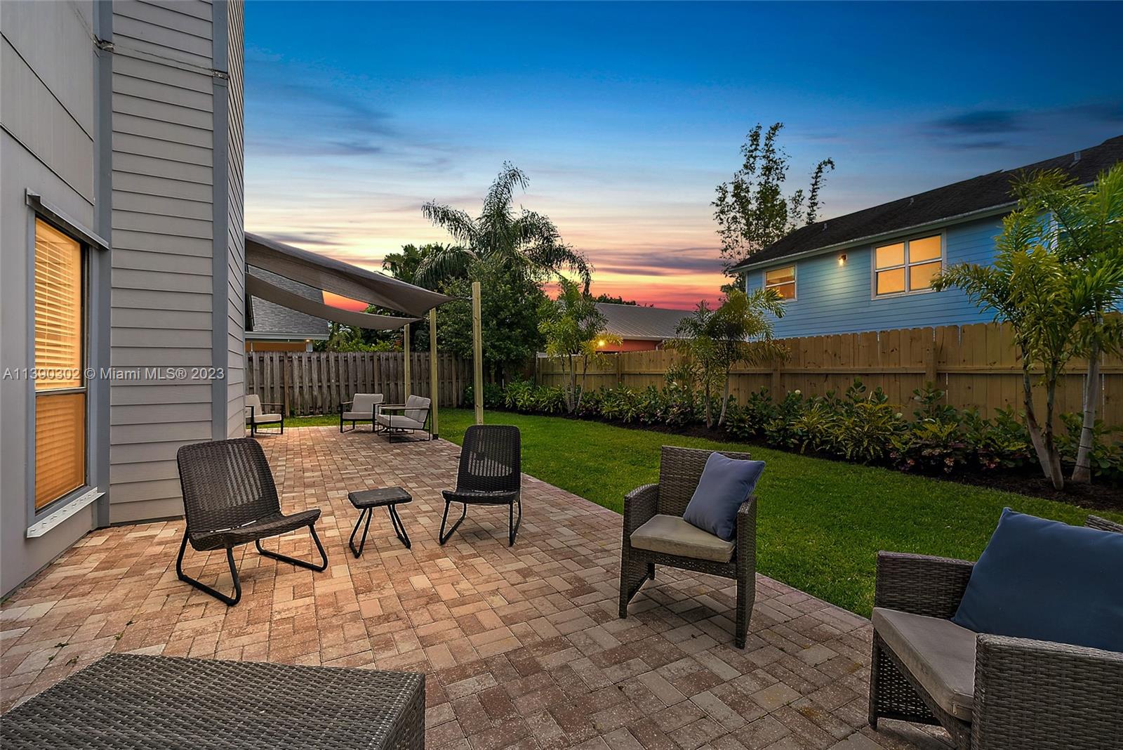 6122 Adams Street Jupiter, FL 33458 - Photo 39 of 59 a view of a patio with a yard