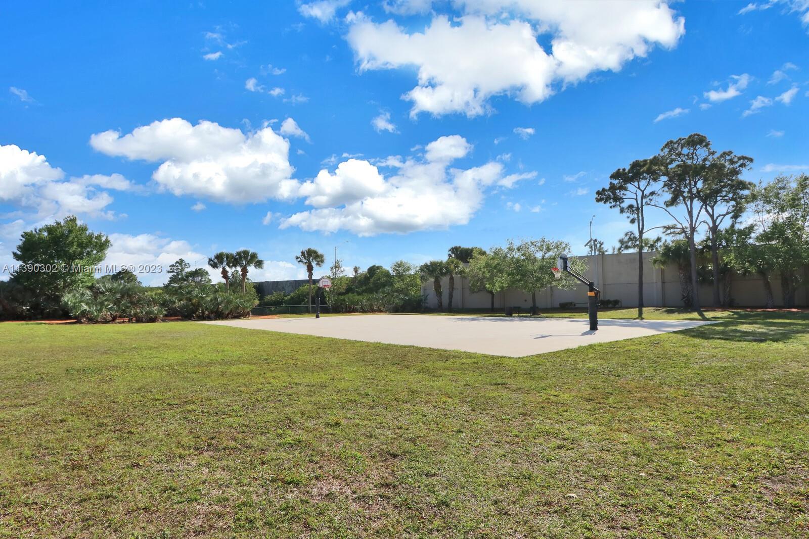 6122 Adams Street Jupiter, FL 33458 - Photo 42 of 59 a view of an outdoor space and yard
