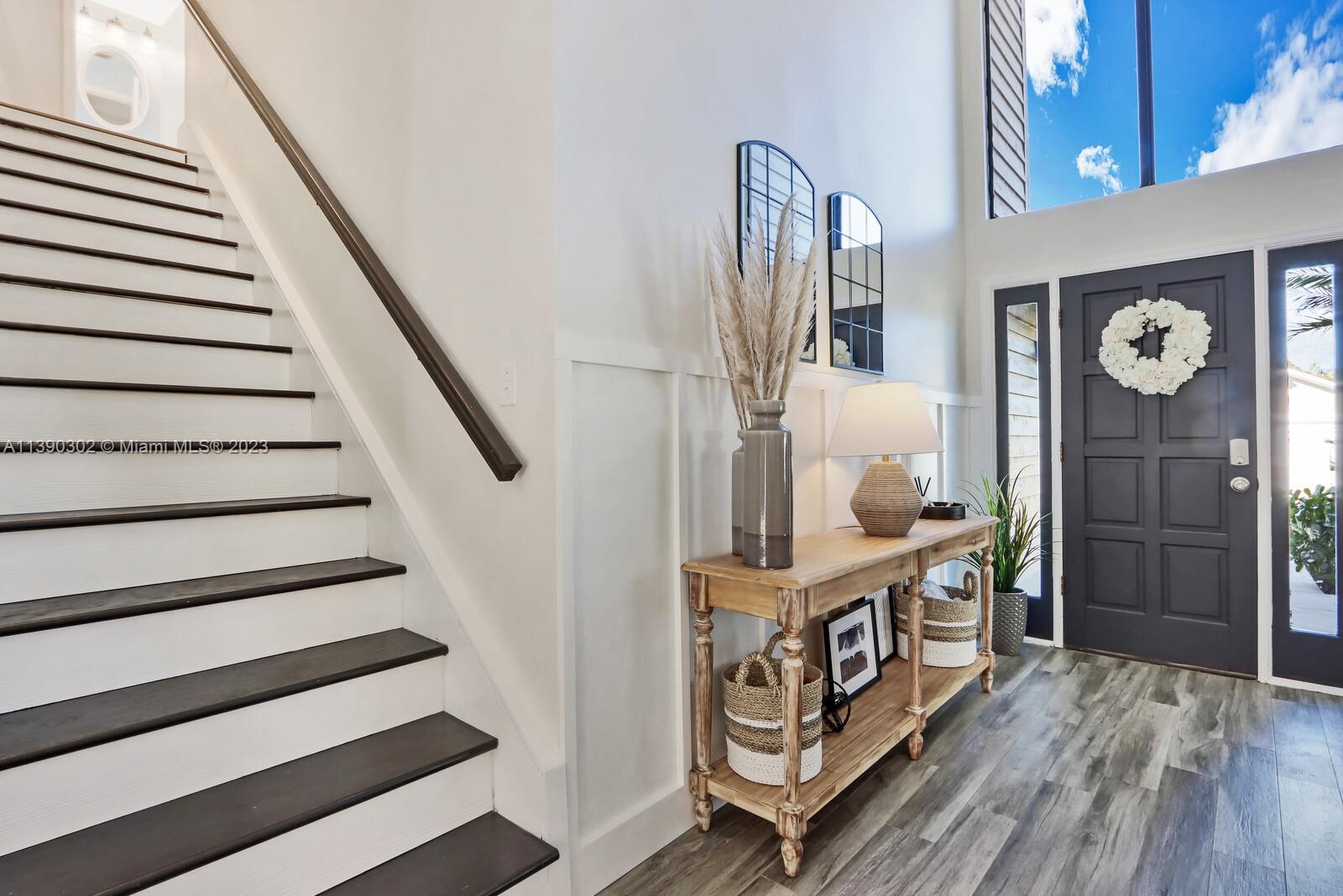 6122 Adams Street Jupiter, FL 33458 - Photo 8 of 59 a view of entryway with wooden floor