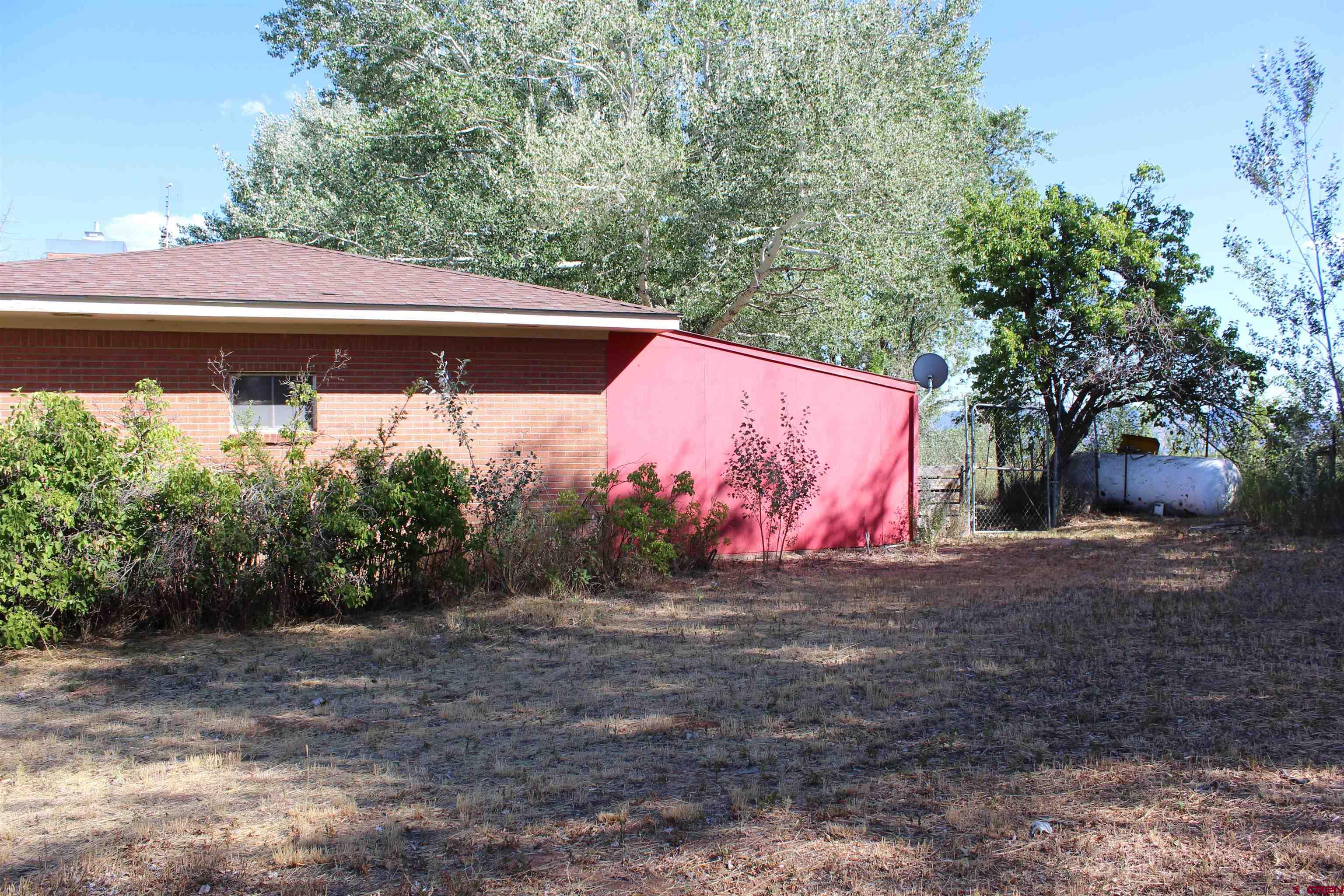 23892 County Rd M Cortez, CO 81321 - Photo 2 of 27 a view of a barn with a yard