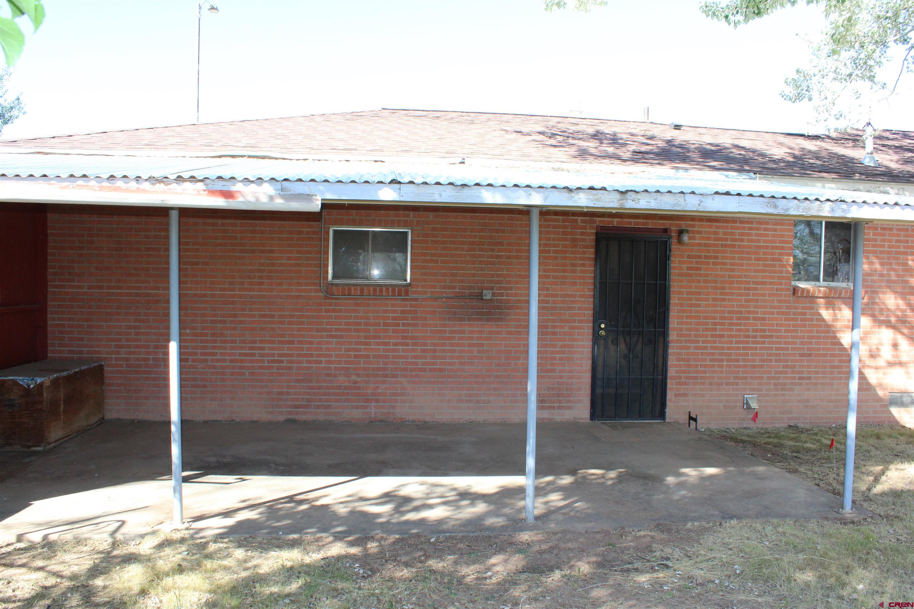 23892 County Rd M Cortez, CO 81321 - Photo 22 of 27 a view of a house with a outdoor space