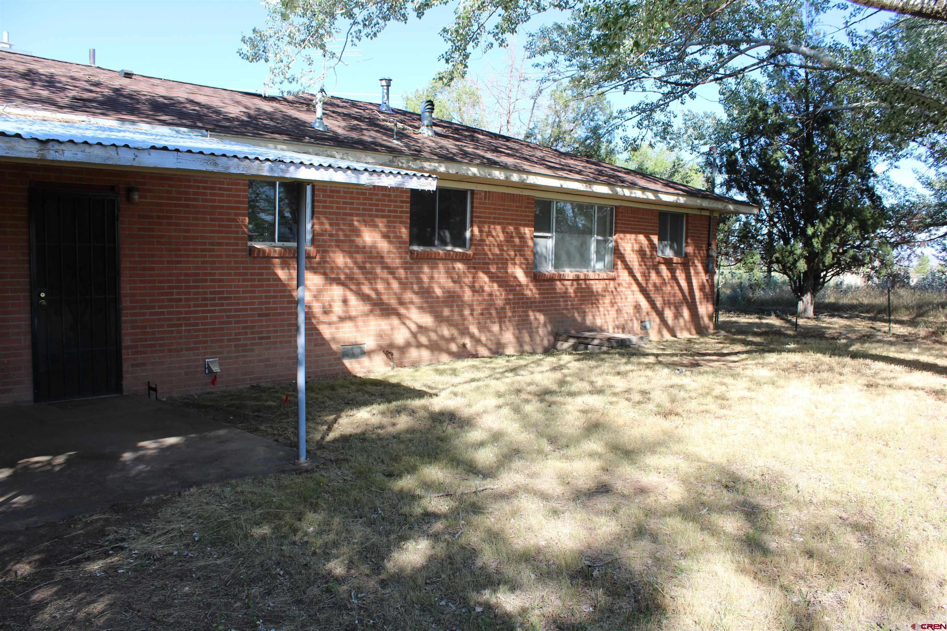 23892 County Rd M Cortez, CO 81321 - Photo 23 of 27 a view of a house with a yard