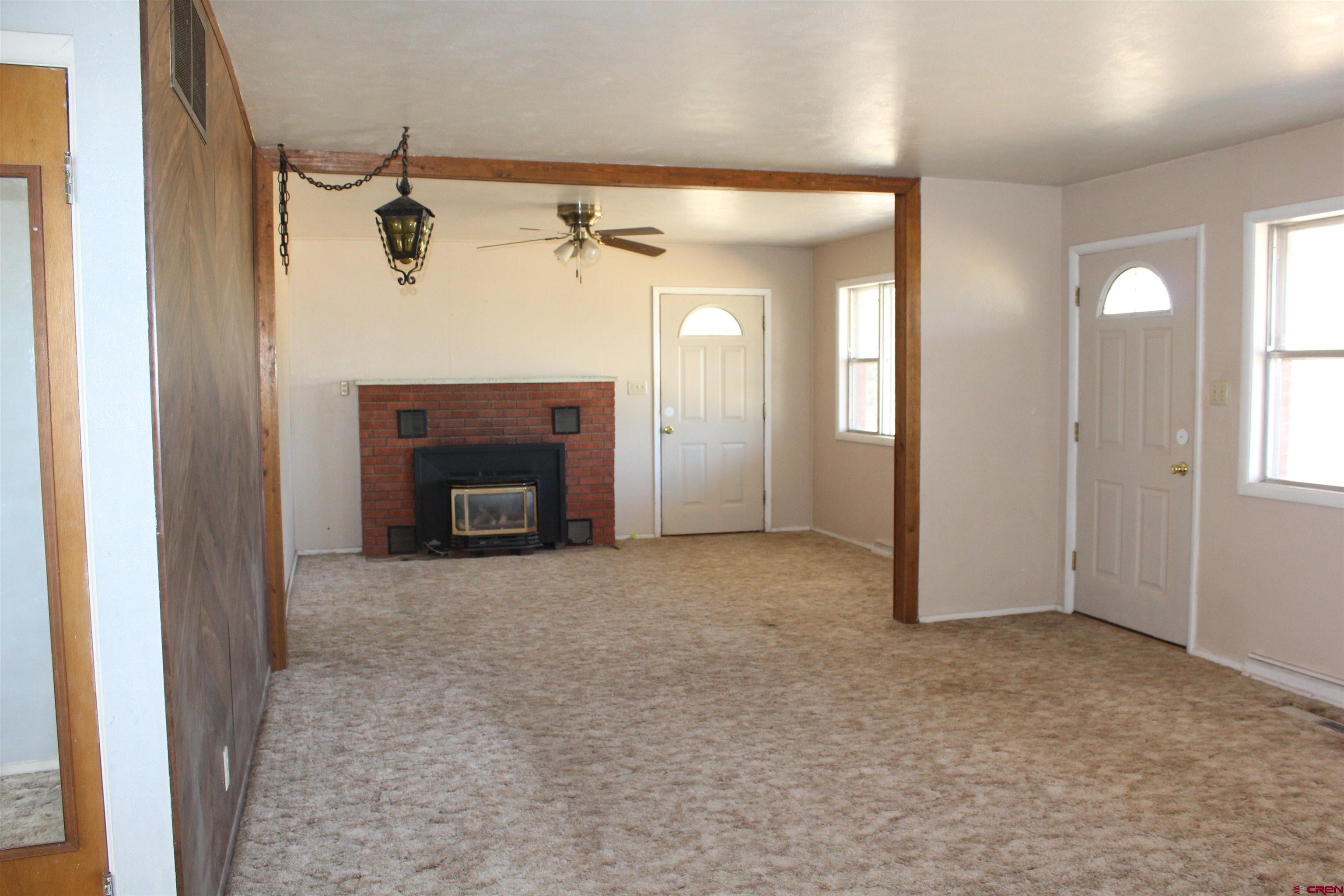 23892 County Rd M Cortez, CO 81321 - Photo 4 of 27 a view of a livingroom with a fireplace