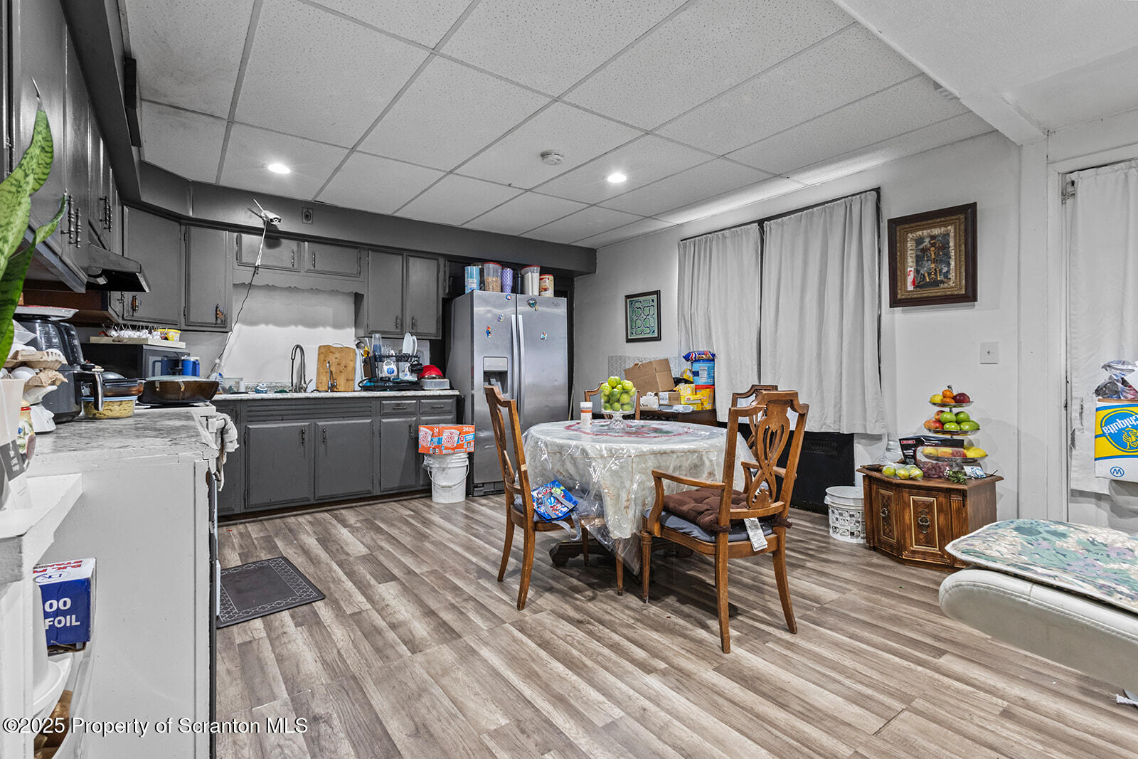 511 Fig Street Scranton, PA 18505 - Photo 17 of 33 a outdoor kitchen with a sink dining table and chairs