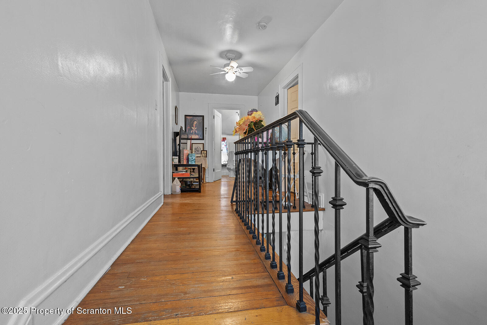 511 Fig Street Scranton, PA 18505 - Photo 20 of 33 a view of staircase with railing and a chandelier