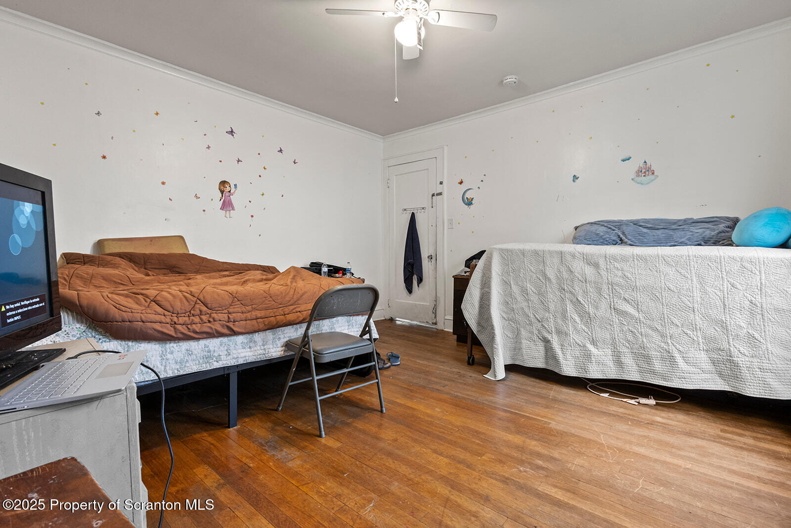 511 Fig Street Scranton, PA 18505 - Photo 25 of 33 a bedroom with a bed and a chandelier