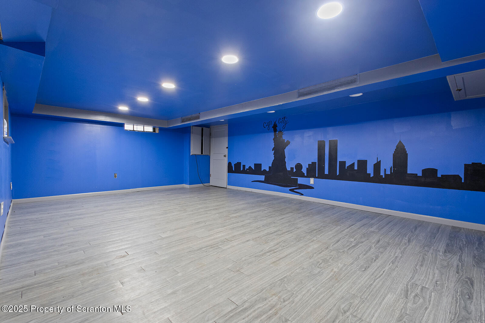 511 Fig Street Scranton, PA 18505 - Photo 27 of 33 a view of an empty room with wooden floor