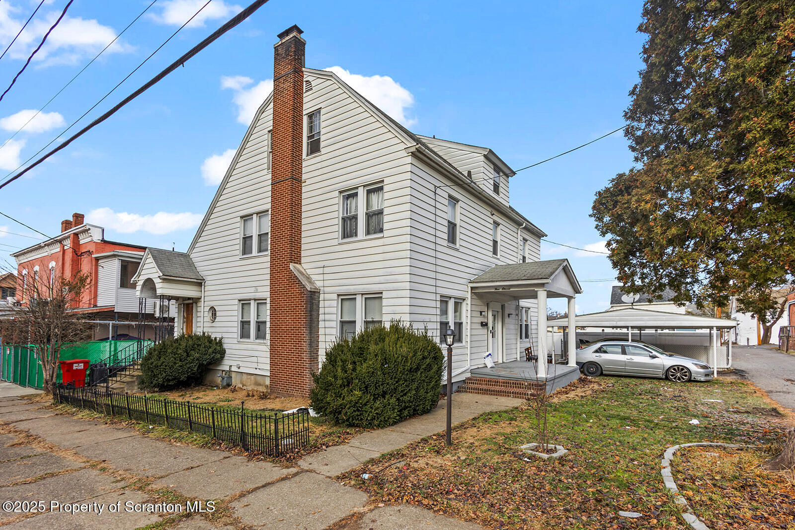 511 Fig Street Scranton, PA 18505 - Photo 32 of 33 a view of a white house next to a yard