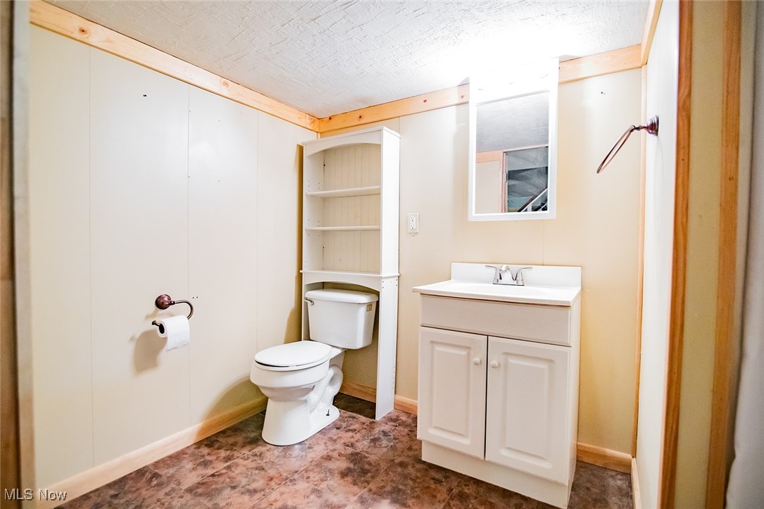 91 Mike Street Washington, WV 26181 - Photo 29 of 42 Half bath with vanity and toilet