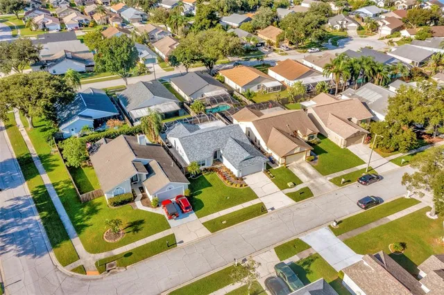 an aerial view of residential houses with outdoor space