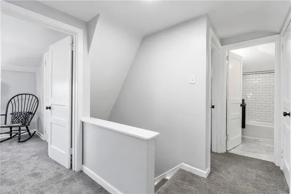 a bedroom with bed and chair