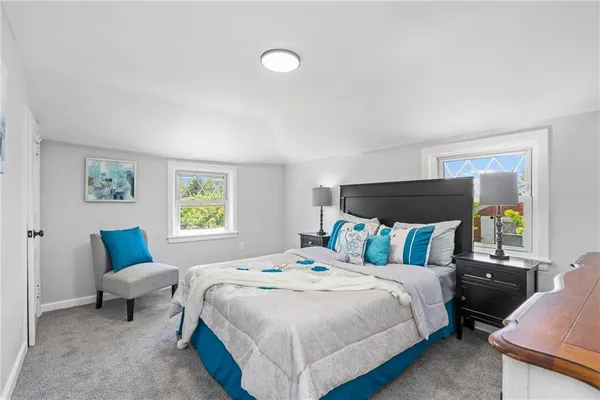 a bedroom with a bed and a couch