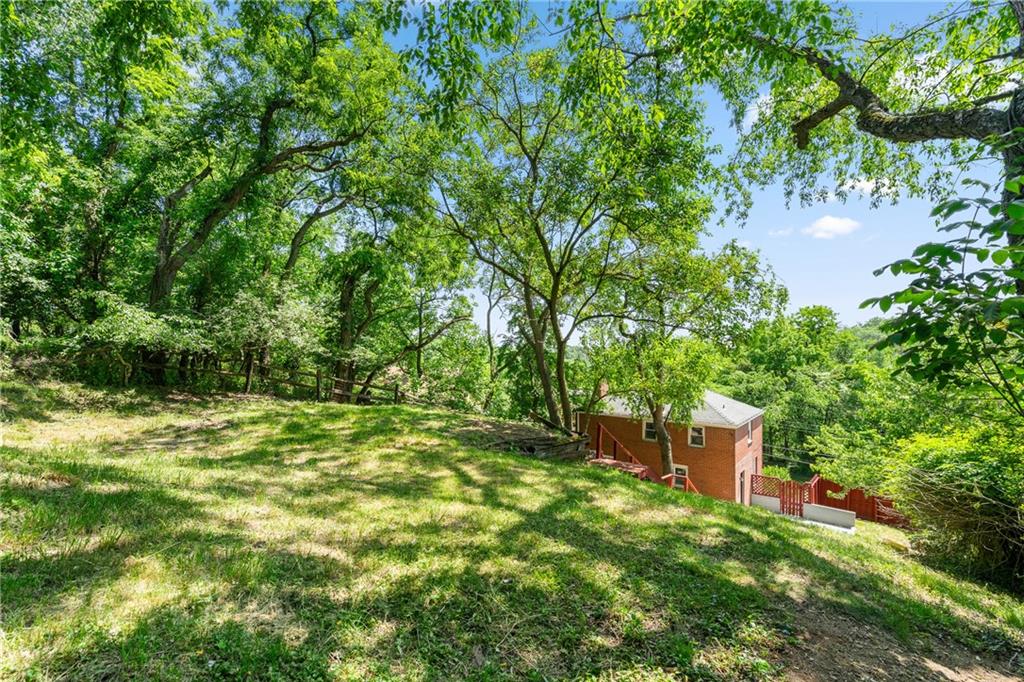 322 Bascom Avenue Pittsburgh, PA 15214 - Photo 28 of 29 a backyard of a house with lots of green space and fountain