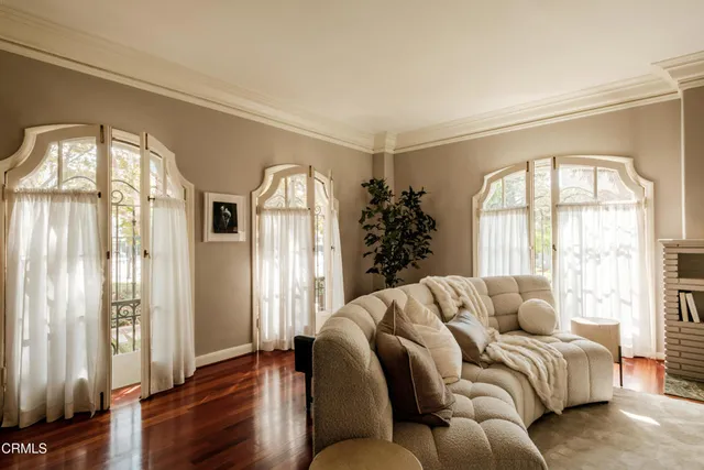 a view of a livingroom with furniture and hardwood floor