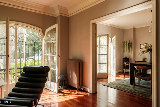 a view of a dining room with furniture and a window