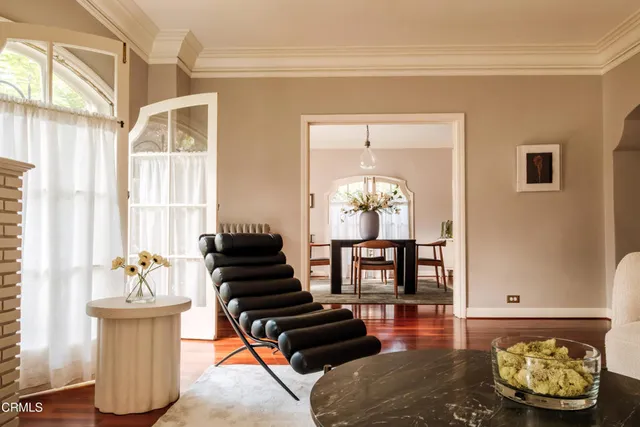 a dining room with furniture and window