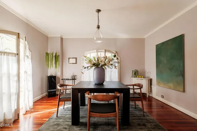 a view of a dining room with furniture and a window