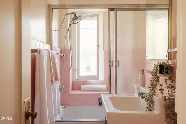 a view of a dining room with furniture and a window