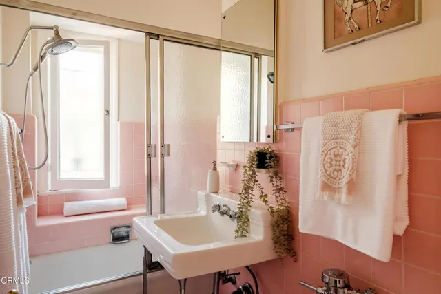 a view of a dining room with furniture and a bookshelf