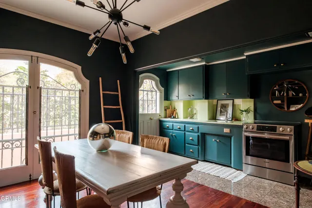 a kitchen with stainless steel appliances granite countertop a stove and a sink