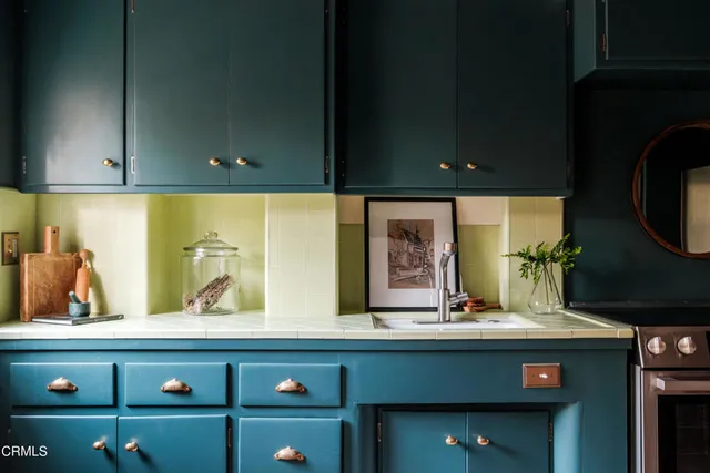 a kitchen with a refrigerator and a sink