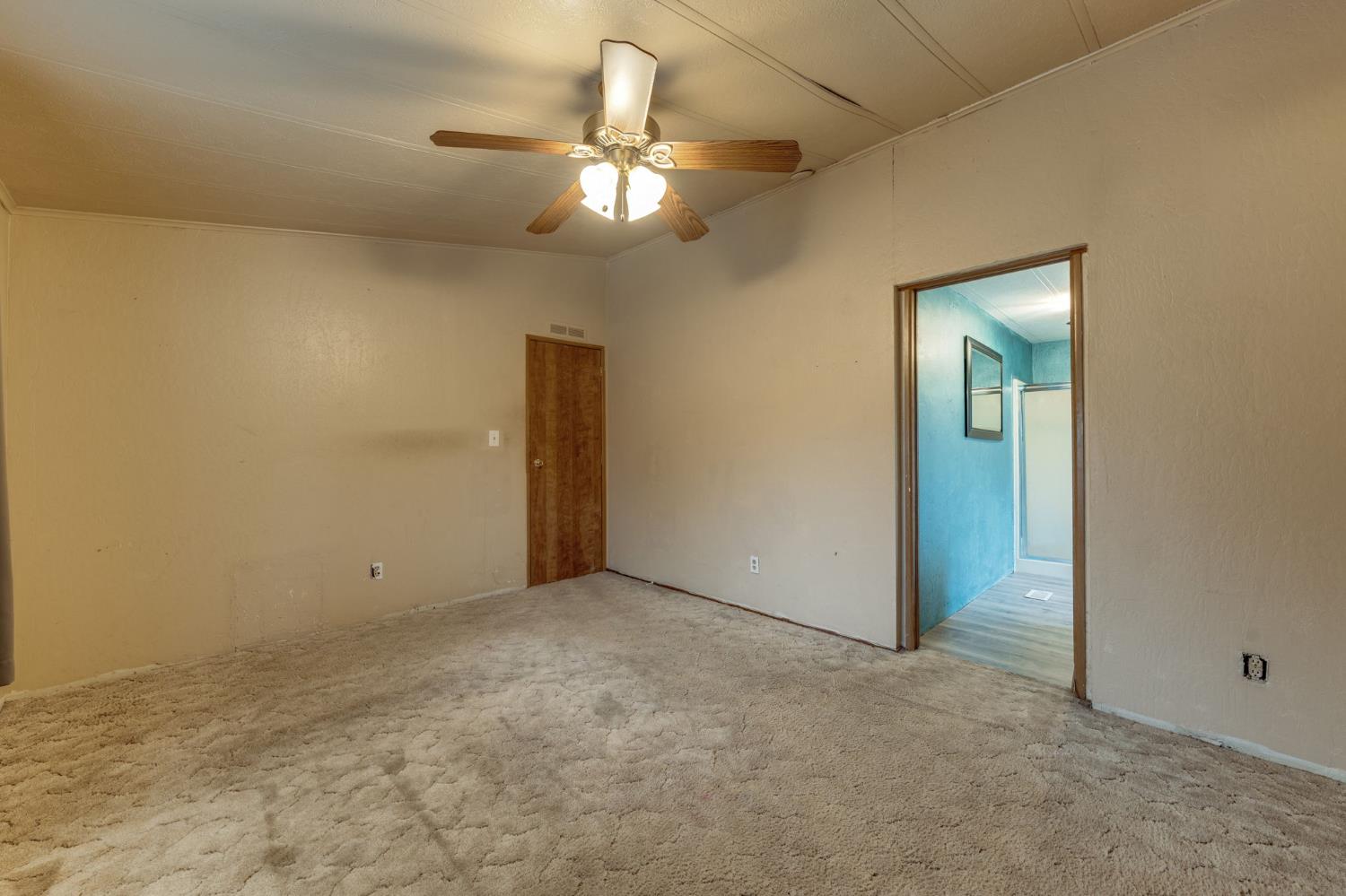 443 Royal Crest Circle Rancho Cordova, CA 95670 - Photo 16 of 28 an empty room with a chandelier fan