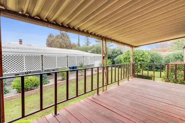 a view of balcony with wooden floor