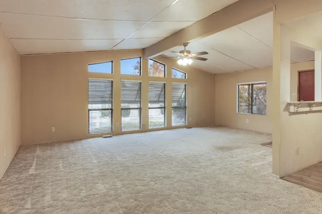 a view of an empty room with a window