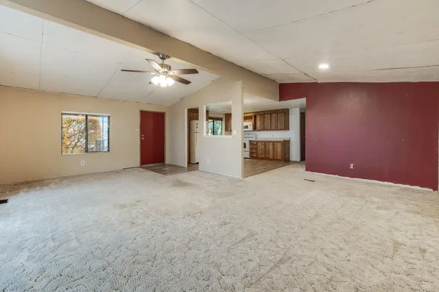 a view of a livingroom with furniture and windows