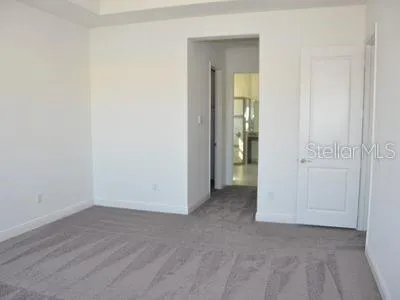 a view of an empty room with a large window