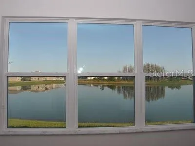 a kitchen with kitchen island a refrigerator sink and cabinets