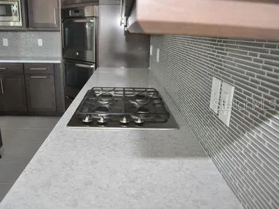 a bathroom with a shower and a sink