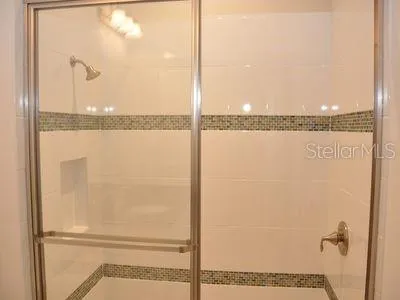 a view of a lake with houses in the back