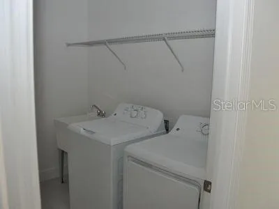 a view of a dining room with furniture wooden floor and a chandelier
