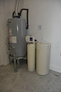 a room with furniture and painting on the wall