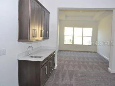 a kitchen with stainless steel appliances granite countertop a sink and cabinets