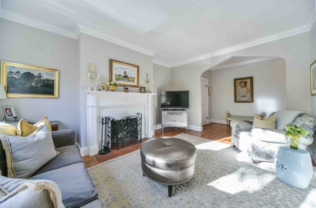 123 Winthrop Road, Unit 1 Brookline, MA 02445 - Photo 5 of 13 a living room with furniture and a fireplace
