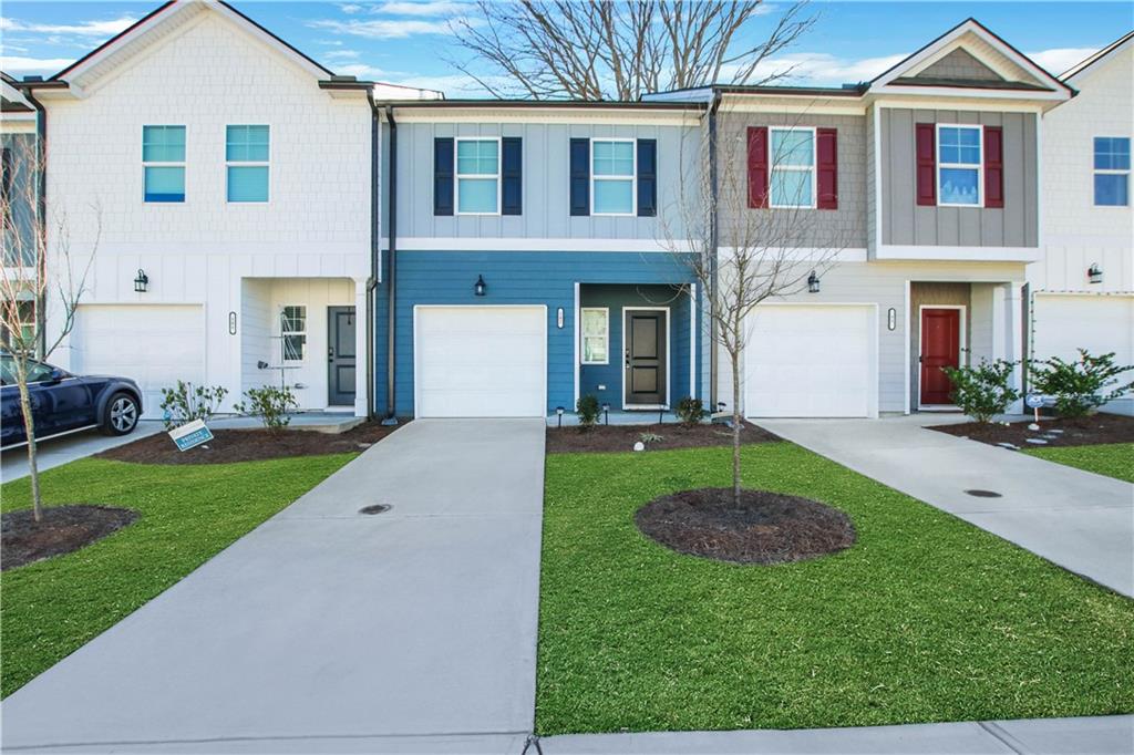 a view of a yard in front view of a house