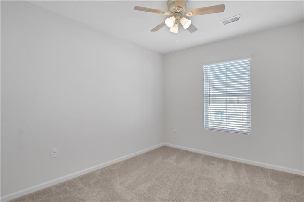 102 Jaxton Street Hoschton, GA 30548 - Photo 27 of 36 an empty room with a window