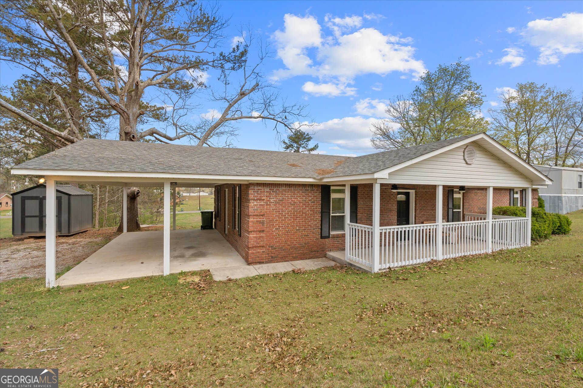 269 Eldred Street Lineville, AL 36266 - Photo 4 of 11 front view of a house with a yard
