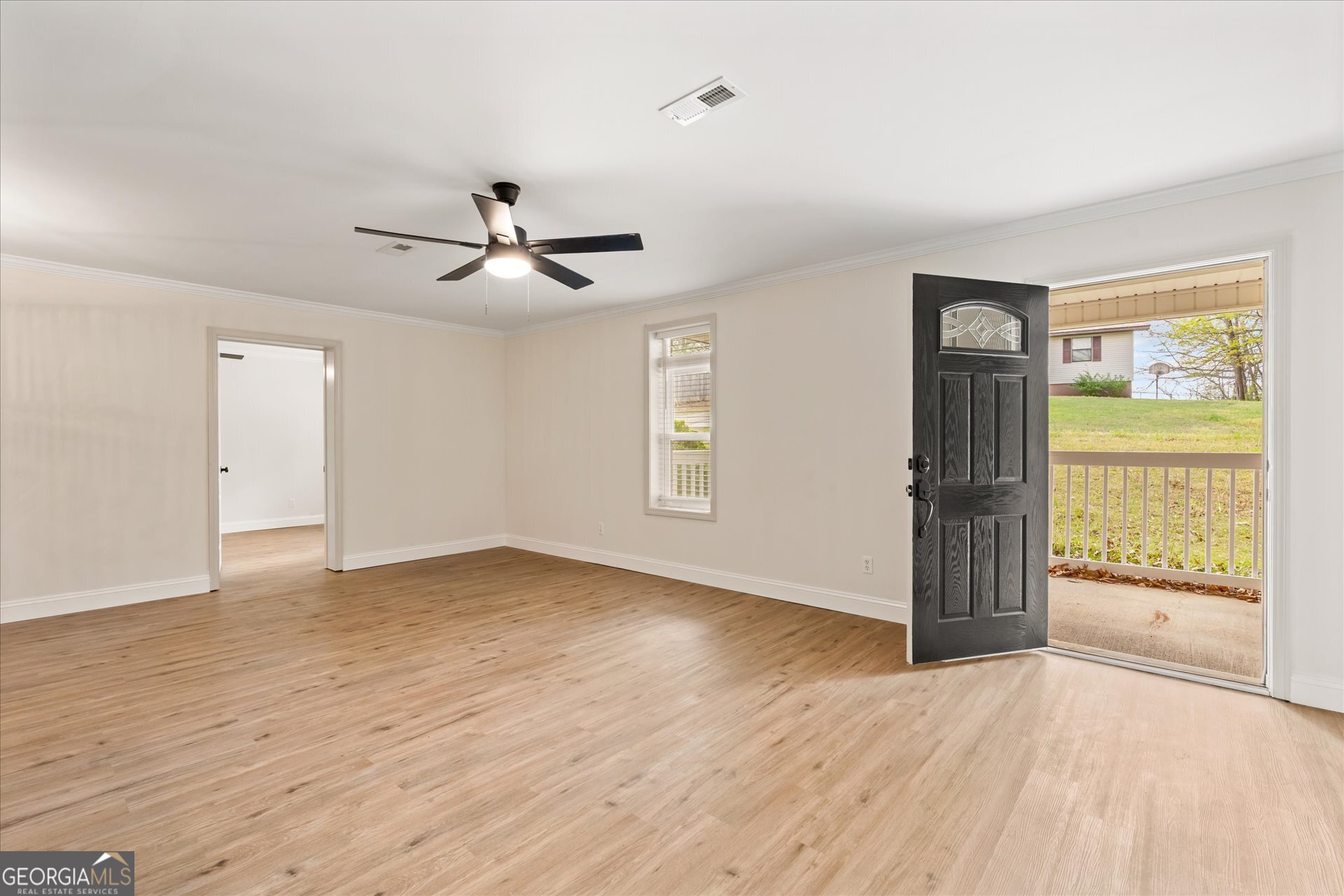 269 Eldred Street Lineville, AL 36266 - Photo 10 of 11 an empty room with fan and windows