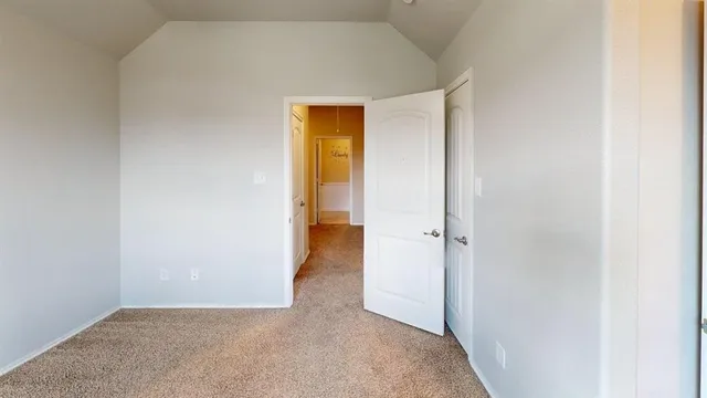 a view of a bathroom with a hallway
