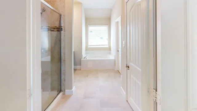 a view of a bathroom from a hallway