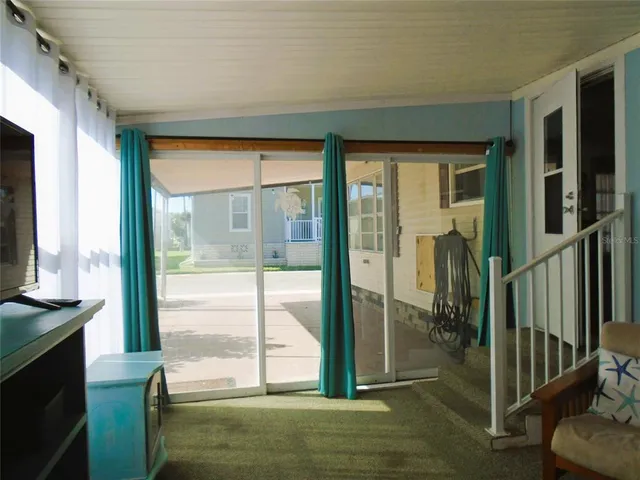 a bedroom with a couch and a window