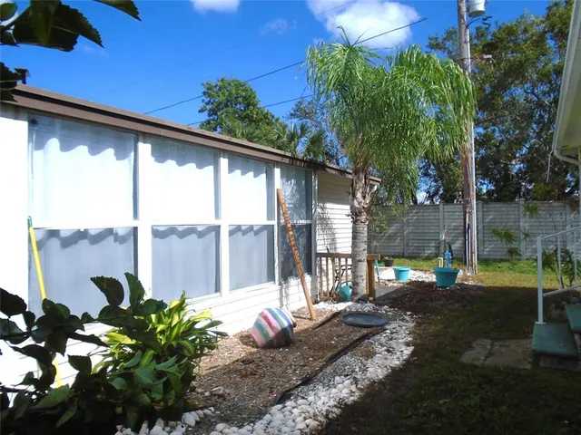 a view of a porch with a garden