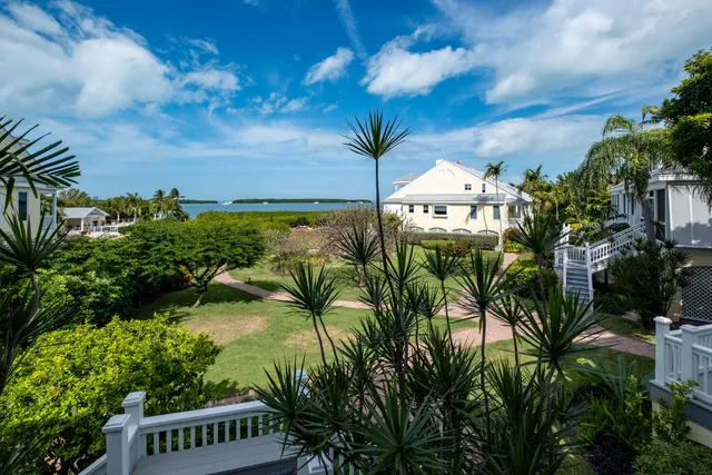 a view of an entryway with wooden floor and windows