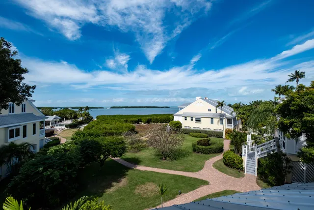 a view of a chairs and table in the patio