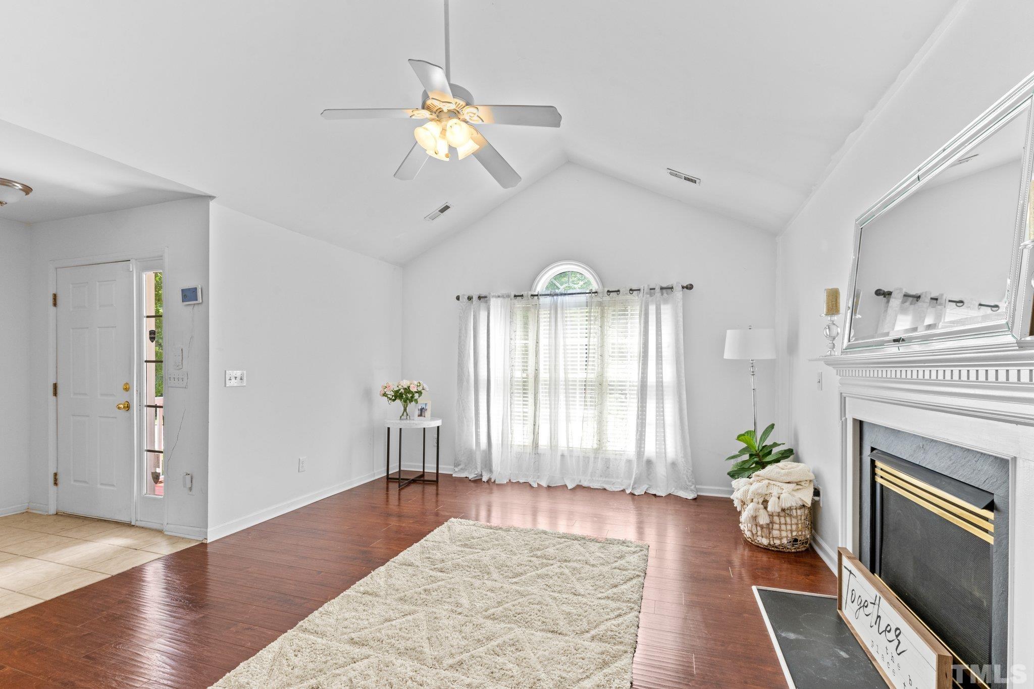 4609 Sinclair Drive Raleigh, NC 27616 - Photo 6 of 34 a living room with furniture fireplace and wooden floor